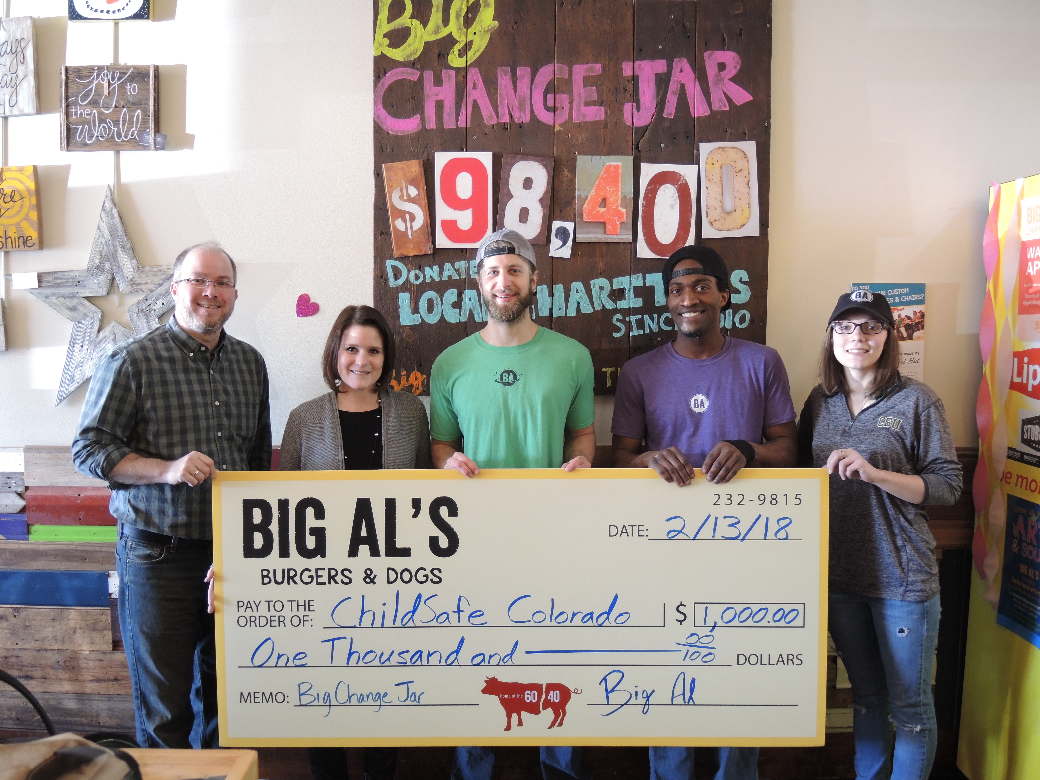 Image of Big Al's Employees holding a check for $1,000.00