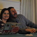 Images of two people smiling at their computers