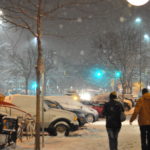 Image of people walking in snowy night