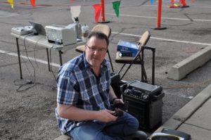 Image of guy setting up microphone