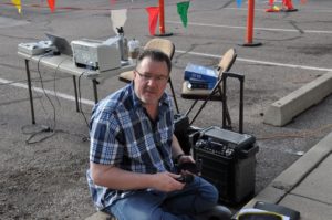 Image of guy setting up microphone