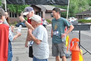 Picture contestants of people standing at finish line