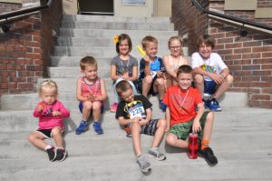 Image of kids sitting on stairs
