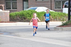 Image of two little boys running