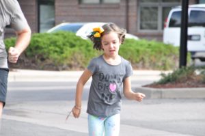 Image of little girl running