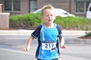 Image of little boy running