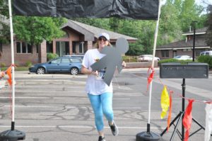 Image of woman running with human cutout