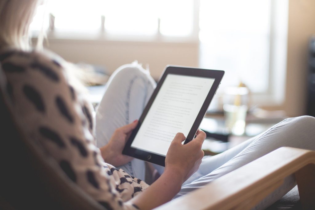 person reading on a kindle